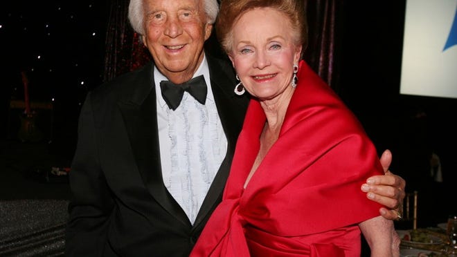 Simon and Norma Fireman attend the Leaders in Furthering Education Lady in Red Gala in December. Mr. Fireman died Saturday.