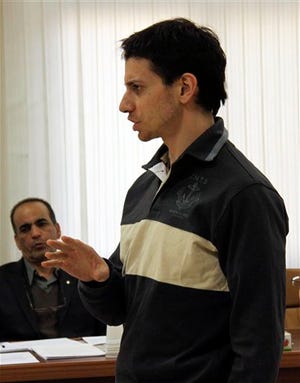 In this Sunday, Feb. 6, 2011 file photo, US hiker Josh Fattal, speaks before the judge, unseen, with his lawyer Masoud Shafiei, background, in a court room, at the Tehran Revolutionary Court, Iran. The website of Iran's state TV reported Saturday, Aug. 20, 2011 that two Americans held in Iran have been sentenced to 8 years in jail each.