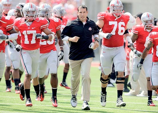 Ohio State coach Luke Fickell leads his team onto the field to face Akron in a Sept. 3 game in Columbus, Ohio. The Associated Press