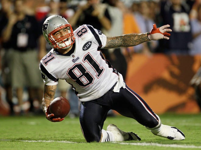 New England Patriots tight end Aaron Hernandez smiles after running the ball during the second half of an NFL football game against the Miami Dolphins, Monday, Sept. 12, 2011, in Miami. (AP Photo/J. Pat Carter)