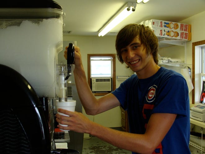 TJ Syndram, manager of The Dugout At Eureka, fixes a slushie.