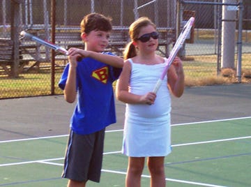Bryson Brown and Daniell Rose get some practice in before this weekend’s 10-and-under tennis tournament at Oak Ridge High School.