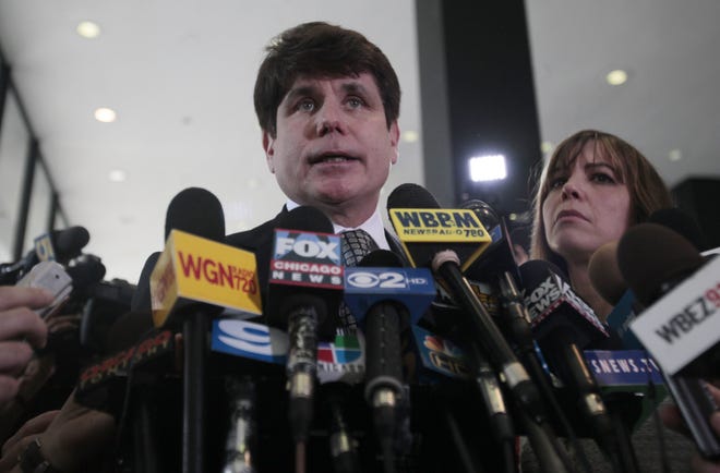 Former Illinois Gov. Rod Blagojevich speaks to the media at the Federal Courthouse Monday, June 27, 2011 in Chicago. Blagojevich has been convicted of 17 of the 20 charges against him, including all 11 charges related to his attempt to sell or trade President Barack Obama's vacated Senate seat. At right is his wife Patti. (AP Photo/Kiichiro Sato)