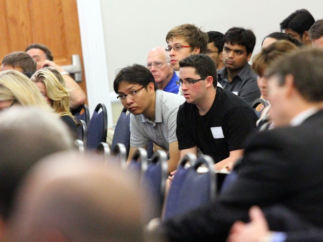 Attendees of the University of Florida's Engineering the Innovation Economy summit listen to panelists speak at Emerson Alumni Hall on campus in Gainesville on Friday.