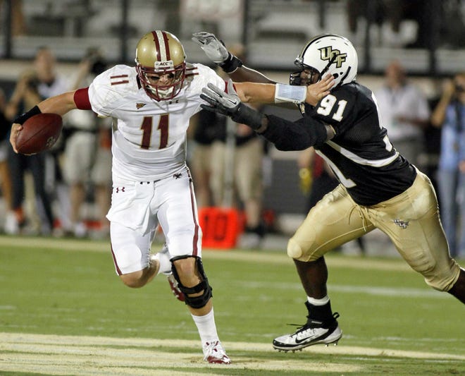 Boston College quarterback Chase Rettig (11) is chased by Central Florida defensive lineman Victor Gray (91) during the first half of an NCAA college football game on Saturday, Sept. 10, 2011, in Orlando, Fla.