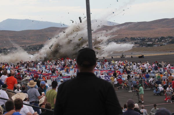 A P-51 Mustang airplane crashes during a popular air show in Reno, Nev. The World War II-era fighter plane, flown by veteran Hollywood stunt pilot Jimmy Leeward, plunged into the edge of the grandstands on Friday.