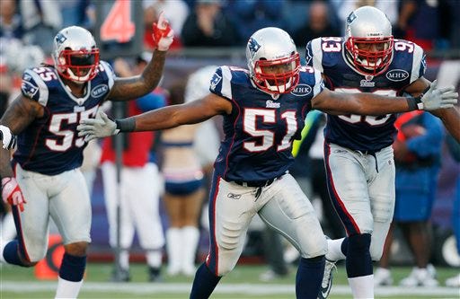 Patriots inside linebacker Jerod Mayo (51) celebrates with inside linebacker Brandon Spikes (55) and defensive end Andre Carter after preventing a touchdown near the goal line by the San Diego Chargers in the second quarter of the Pats' victory on Sunday in Foxboro.