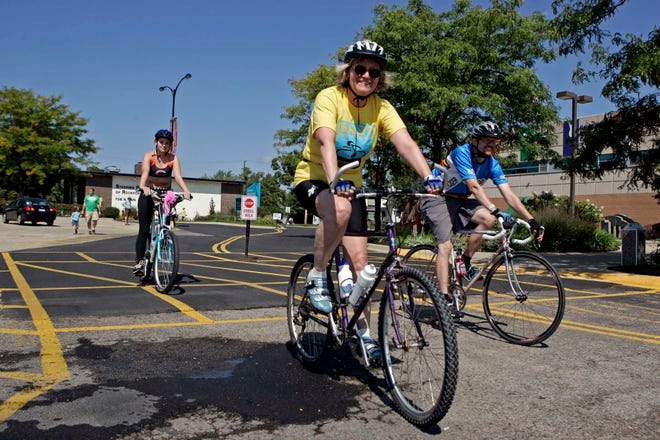 Riders Katy Osborne (from left), Gayle Englof and Victor Schoonover, all of Rockford, participate in the BART - Bike for the Arts ride Sunday, Sept. 11, 2011, at the Riverfront Museum Park in Rockford. Bicyclists rode on a five-mile family route, a 35-mile or a 64-mile ride to benefit local arts organizations.