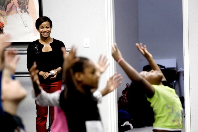Kam Phillips watches as Boys & Girls Club members participate in tryouts Thursday at the School of Missouri Contemporary Ballet. Phillips, a University of Missouri senior, recently started the Dance Outside the Box program for children, an offshoot of her Dream Outside the Box initiative.