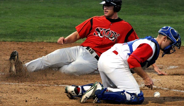 Ports catcher Ryan Lipkin loses control of the ball as Lake Elsinore's Nate Freiman slides safely into home plate in the fourth inning on Sunday at Stockton Ballpark.