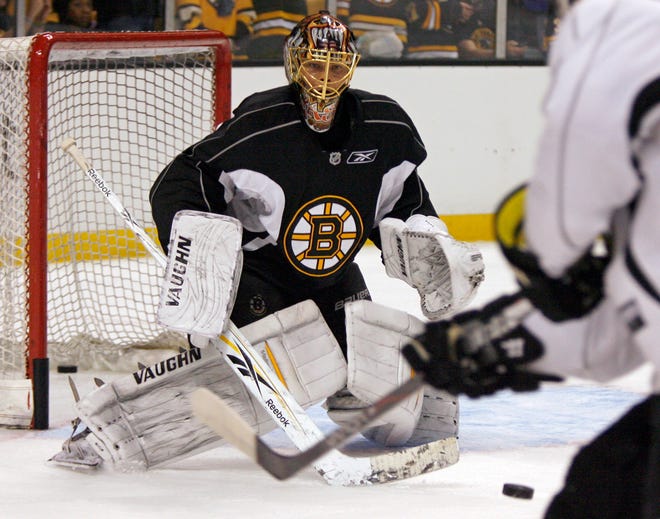 Boston Bruins goalie Tuukka Rask keeps his eye on the puck during Saturday's training camp at TD Garden in Boston.