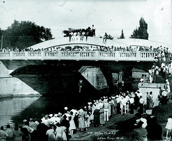 The Indian River bridge was nine years old when this picture was taken in 1933, complete with many residents of the town in attendance. Tuscarora Township trustee Jane McGinnis hopes to have a similar photo set up on Oct. 9.