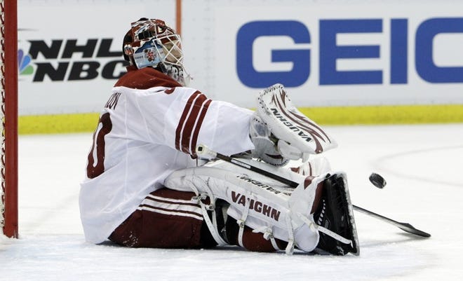 Phoenix Coyotes goalie Ilya Bryzgalov of Russia throws back the puck after giving up the third goal during the first period in Game 2 of a first-round Stanley Cup playoff series against the Detroit Red Wings in Detroit on April 16.