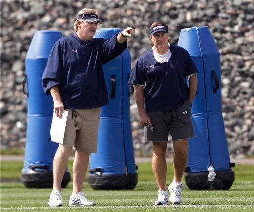 Patriots special teams coach Scott O'Brien, left, confers with head coach Bill Belichick during practice on Wednesday in Foxboro.