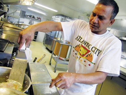 Photo by Steven Reilly/New Jersey Herald 
 
  
Chef Ali Shah prepares a dish at the Victoria Diner on State Route 206 in Branchville.