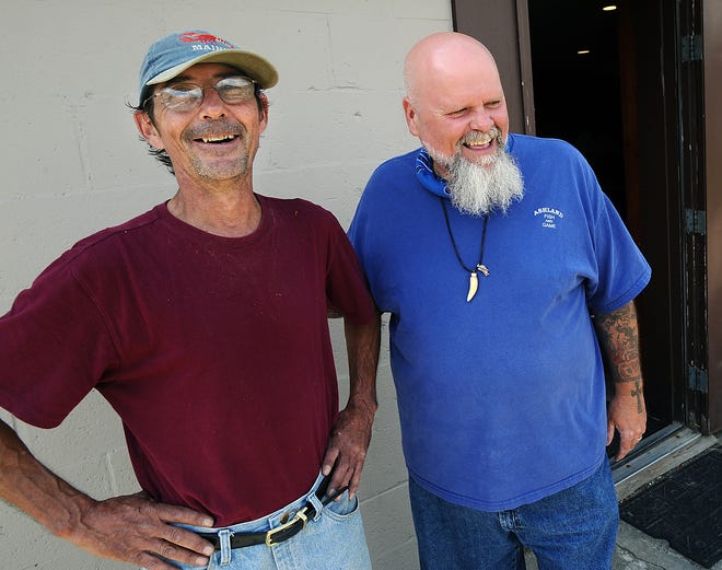 Joseph Milan, right, president of the Ashland Fish and Game Club, reunites with Bob Walenski of Ashland, who saved him from choking.