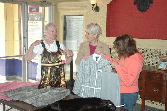 Nancy Sawruck, Colleen Arbic, and Julie McLeod sort clothes at the Soo Theatre for the upcoming Second Hand Rose luncheon and clothing sale on Sept. 24 at the Sault Ste. Marie Country Club. New and gently used designer brand clothing and accessories will be available to try on and purchase. A three-course luncheon will be served with musical entertainment at noon. Tickets for the Soo Theatre fund-raiser are available at the office, or by calling (906) 632-1930, with proceeds going towards lobby renovation.