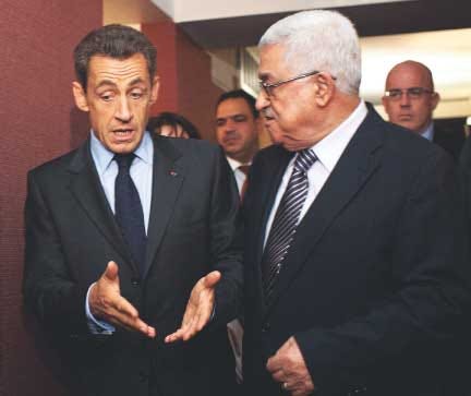 French President Nicolas Sarkozy (left) meets with Palestinian
President Mahmoud Abbas at the Millennium Hotel on 44th Street
during the 66th session of the General Assembly in New York on
Tuesday.