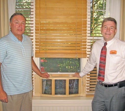 Michael Law (left) owner of NorEasterTough, is pictured with Peter Mac- Donald, executive director of Sunrise Assisted Living.