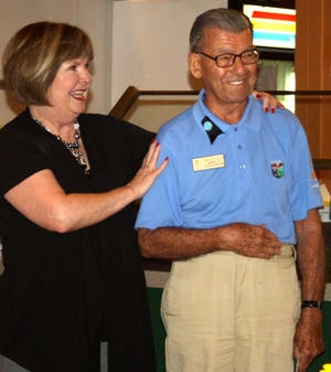 Volunteer Dan Suttelle, right, is congratulated by Jody Sutton, director of community relations at the World Golf Hall of Fame, during his 90th birthday party at WGV on Tuesday, September 20, 2011. Submitted Photo