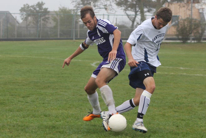 Bourne's Luke Weatherbury, left, battles Nantucket's Shaun Stojak in nonleague boys soccer action on Saturday. Host Nantucket rallied for a 3-2 victory.