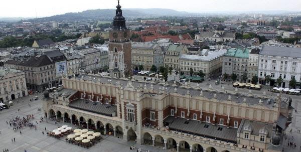 The main square of the Old Town in Krakow, Poland. With crowds of tourists and a college-town atmosphere, Krakow – once the capital of Poland – has become a European hot spot.