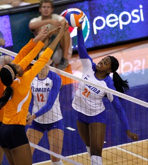 Florida's Cassandra Anderson (21) tries to spike the ball during a match against Tennessee at the O'Connell Center on Sunday. Florida lost 3-2 in five sets against the Vols.