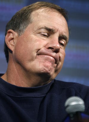 New England Patriots NFL football team head coach Bill Belichick reacts while taking questions from reporters during a news conference, in Foxborough, Mass., Monday, Sept. 26, 2011. The Buffalo Bills defeated the Patriots 34-31 on Sunday. (AP Photo/Steven Senne)