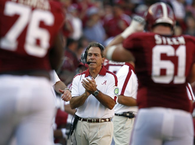 Alabama coach Nick Saban cheers on his offense after they scored a touchdown in the second half of an NCAA college football game against Arkansas on Saturday, Sept. 24, 2011, in Tuscaloosa, Ala. (AP Photo/Butch Dill)