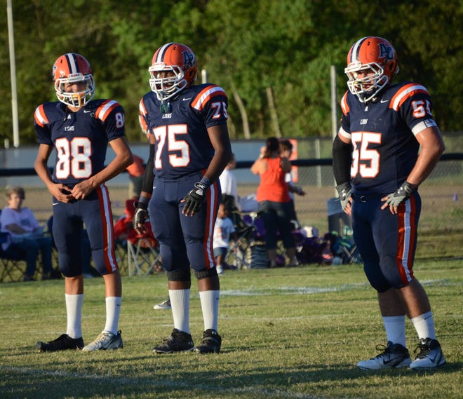 Ascension Christian’s Logan Kinchen, Mohammad Baheth and Tyler Johnson getting ready for play. The Lions suffered a setback to Dunham Friday.