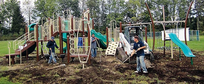 Photo by Steven Reilly/New Jersey Herald 
Workers from Whirl Construction install new playground equipment at Sandyston-Walpack Elementary School.
