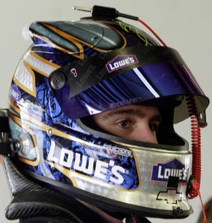 Jimmie Johnson gets ready Sunday for practice for the Sylvania 300. The Associated Press
