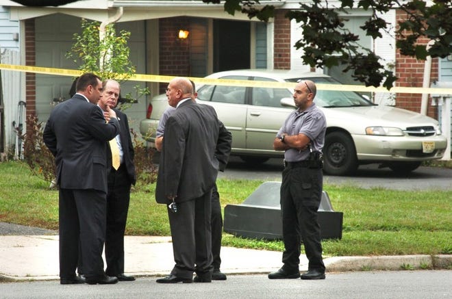 Burlington County and Willingboro detectives work the scene of a police-involved shooting in Willingboro in September 2011. The township has paid $250,000 in a settlement with the man who was shot.