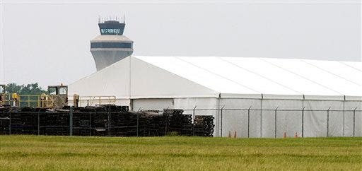 In this photo taken May 28, 2011, an air cargo storage tent is seen in front of the control tower at the MidAmerica St. Louis Airport near Mascoutah.