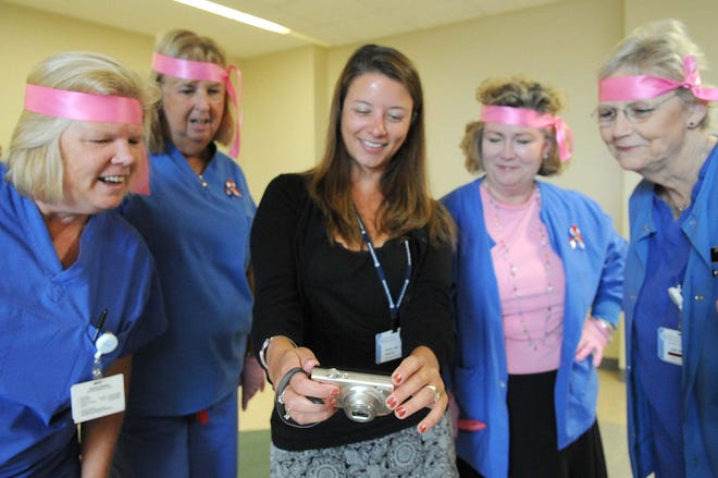 From left, Corinne Ryan-Eranio, Julie Connors, Rachel Labas, Marie Katz, and Jane Reddy. Paint the Town Pink video at Signature Healthcare at Brockton Hospital , on September 14, 2011.