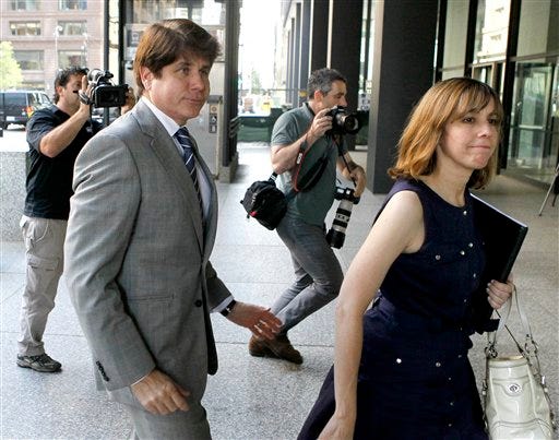 Former Illinois Gov. Rod Blagojevich, left, and his wife, Patti, arrive at the federal courthouse for a hearing in Chicago, Friday, July 15, 2011.
