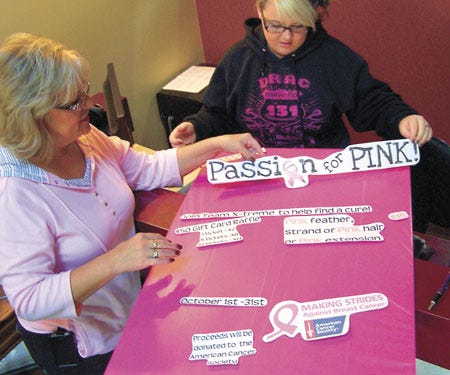 X-treme Hair Lengths in Centreville is staging a month-long “Passion for Pink” breast cancer fundraiser starting Saturday. Putting together a sign to promote the event are Teresa Shingledecker, left, and stylist Ashley Hitt.