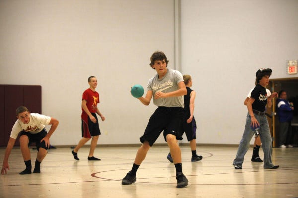Above: Ryan Price, 14, takes part in a dodgeball match at Shalom United Methodist Church in Carroll, after the varsity football game at Bloom-Carroll High School.