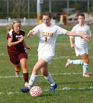 Cardinal Spellman High School's Ally Madden (1) tries to beat Bishop Stang High School's Emma Lafrance (22) to the ball during the game in Brockton on Thursday, September 29, 2011.