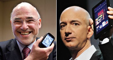 Léo Apotheker, left, Hewlet-Packard's former chief, with the Palm Pre, and Jeff Bezos, founder of Amazon, with the Kindle Fire.
