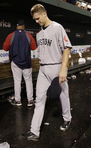 Red Sox closer Jonathan Papelbon leaves the dugout after blowing the lead in the ninth inning of Boston's season-ending loss to the Orioles on Wednesday night.