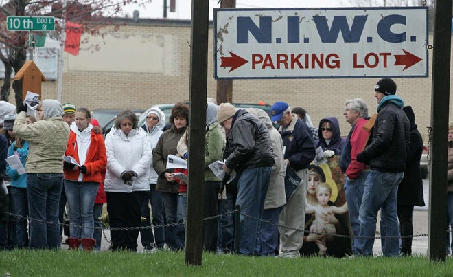 Abortion protesters pray Friday, April 22, 2011, outside the Northern Illinois Women's Clinic in Rockford.