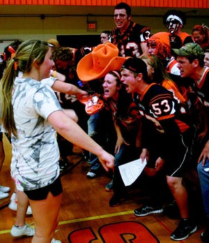 The Class of 2013 at Cheboygan Area High School needed little enticement from the school’s cheerleading crew (left) during their spirit cheer at a school pep rally Friday. The class won the six-event competition at the rally, but finished the behind the senior class in the week’s festivities.