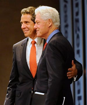 New York Gov. Andrew Cuomo and Former President Bill Clinton during a New York Open for Business Statewide Conference at the Empire State Plaza Convention Center in Albany, N.Y., Tuesday, Sept. 27, 2011. A $4.4 billion high-tech project involving five global companies will create or retain 6,900 jobs statewide, Cuomo announced Tuesday. (AP Photo/Hans Pennink)