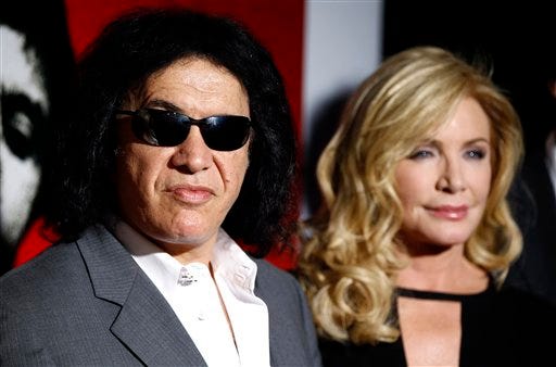 In this Aug. 23, 2011 file photo, Gene Simmons, left, and Shannon Tweed arrive at the "Scarface" Legacy Celebration Event in Los Angeles. Rocker Gene Simmons and his longtime girlfriend, actress Shannon Tweed, have tied the knot Saturday Oct. 1, 2011. People magazine reported the couple exchanged vows they wrote themselves. The magazine said about 400 guests attended the Saturday evening ceremony outside a Beverly Hills hotel.