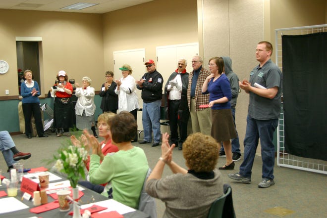 The cast takes a bow at the end of the show at the Chatham Area Public Library's Mystery Dinner, "Death by Download," on Friday, March 11, 2011, at the Chatham Area Public Library.