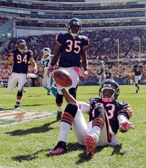 Chicago Bears' Devin Hester (23) celebrates in the end zone after returning a punt 69 yards for a touchdown against the Carolina Panthers in the first half of an NFL football game in Chicago, Sunday, Oct. 2, 2011. (AP Photo/Nam Y. Huh)