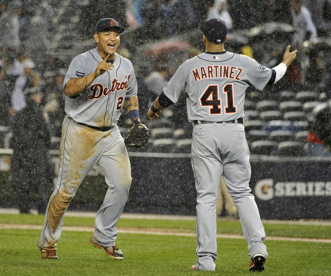 Detroit's Miguel Cabrera, left, and Victor Martinez celebrate the Tigers' 5-3 win over the New York Yankees on Sunday in Game 2 of the American League division series. The series is tied 1-1, and Game 3 is Monday night.