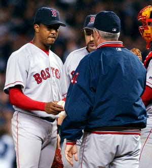 Boston Red Sox pitcher Pedro Martinez is taken out of the game against the New York Yankees by manager Grady Little in the eighth inning of Game 7 of the American League Championship Series in New York Thursday, Oct. 16, 2003.(AP Photo/Charles Krupa)