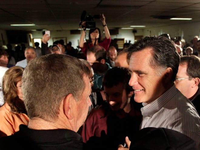 Republican presidential candidate former Massachusetts Gov. Mitt Romney greets a crowd during a campaign stop at the Derry-Salem Elks Lodge 2226 on Monday, Oct. 3, in Salem, N.H. (AP Photo/Jim Cole)